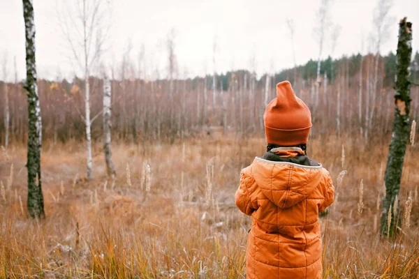 Thoughtful Ten Years Girl Orange Coat Looks Forward Fall Forest — Zdjęcie stockowe