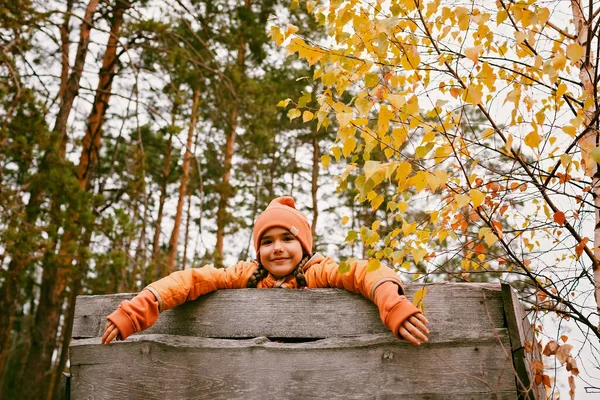 Happy Ten Years Girl Orange Coat Hat Walks Plays Handmade — стоковое фото