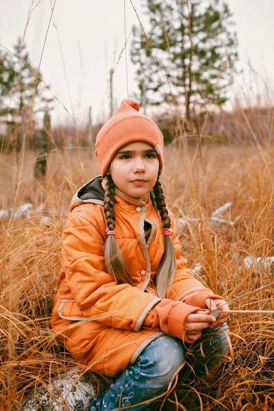 Thoughtful Ten Years Girl Orange Coat Sits Fall Forest High — Foto de Stock