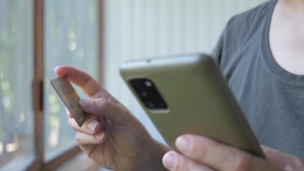 Girl Makes Purchase Using Phone Buying Internet Womens Hands Close — Αρχείο Βίντεο