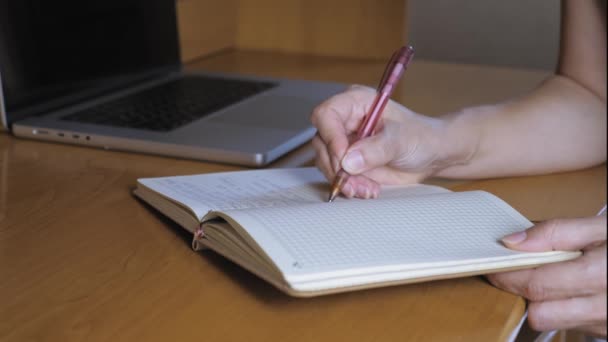 Girl Closes Notebook Takes Ballpoint Pen Makes Note Notebook Woman — Stockvideo