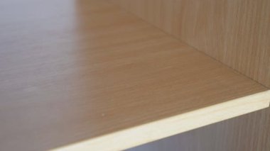 A womans hand takes a bunch of keys from a shelf. The girl leaves the apartment and takes the keys to close the door. High quality 4k footage