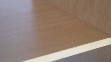 A womans hand takes a bunch of keys from a shelf. The girl leaves the apartment and takes the keys to close the door. High quality 4k footage