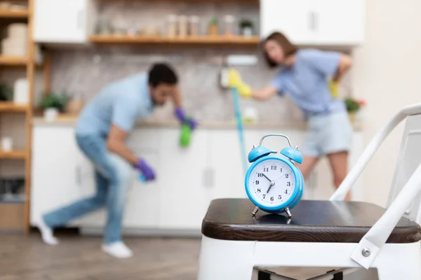 Close Photo Alarm Clock Tired Couple Cleaning Kitchen Background Time — Stock Photo, Image