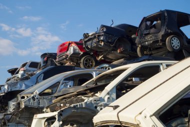Car Cemetery - cars waiting to be recycle in junkyard in Turkey, Ankara - stacked cars in Auto graveyard