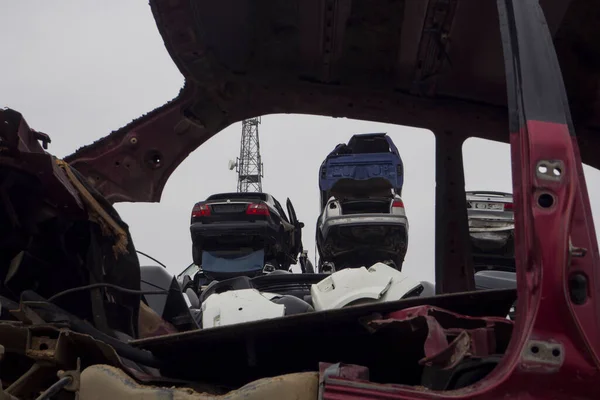 Car Cemetery - cars waiting to be recycle in junkyard in Turkey, Ankara - stacked cars in Auto graveyard