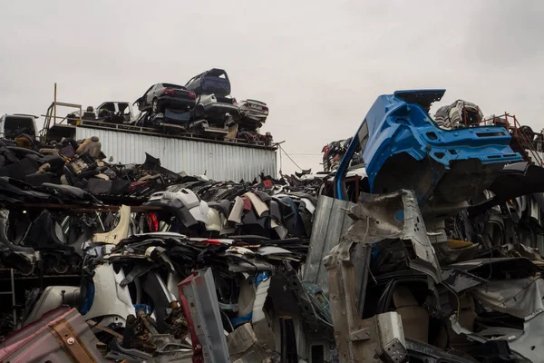 Car Cemetery - cars waiting to be recycle in junkyard in Turkey, Ankara - stacked cars in Auto graveyard