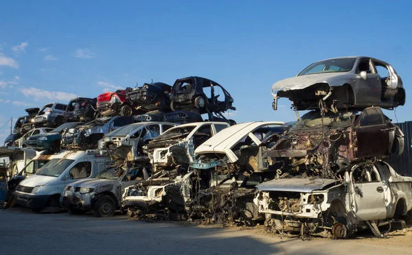 Car Cemetery - cars waiting to be recycle in junkyard in Turkey, Ankara - stacked cars in Auto graveyard