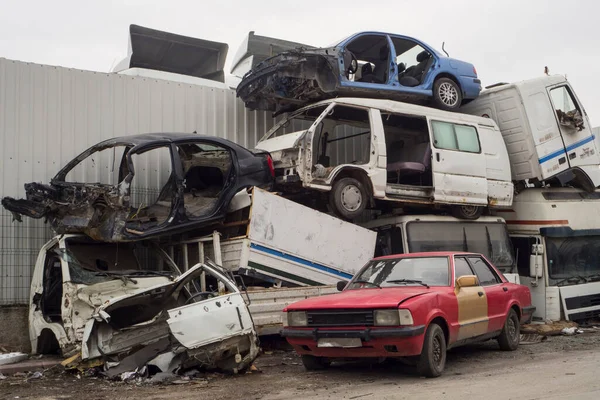 Car Cemetery - cars waiting to be recycle in junkyard in Turkey, Ankara - stacked cars in Auto graveyard