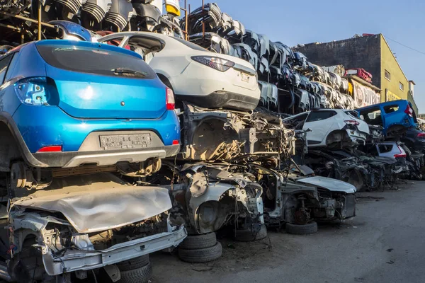 Car Cemetery - cars waiting to be recycle in junkyard in Turkey, Ankara - stacked cars in Auto graveyard