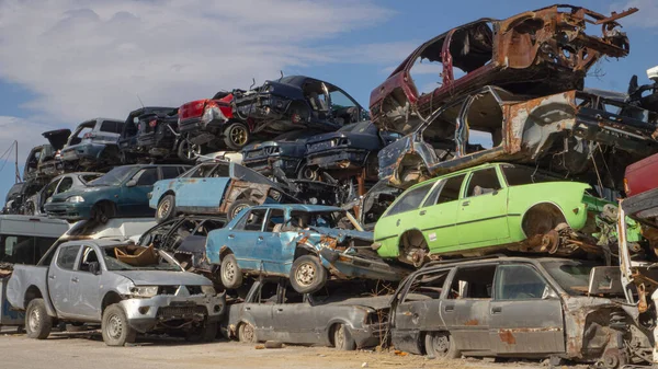 Car Cemetery - cars waiting to be recycle in junkyard in Turkey, Ankara - stacked cars in Auto graveyard