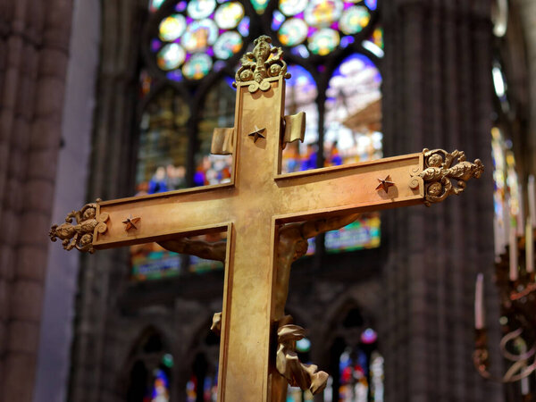 Saint-Denis, France - June 15, 2019: Catholic cross at the Basilica of Saint-Denis