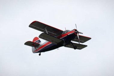 KAUNAS / LITHUANIA - August 10, 2019: Lithuanian LY-AES Antonov An-2 transport aircraft flying at air show in S. Darius and S. Girnas Airport in Aleksotas, Kaunas, Lithuania