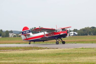 KAUNAS / LITHUANIA - August 10, 2019: Lithuanian LY-AES Antonov An-2 transport aircraft taxiing at air show in S. Darius and S. Girnas Airport in Aleksotas, Kaunas, Lithuania