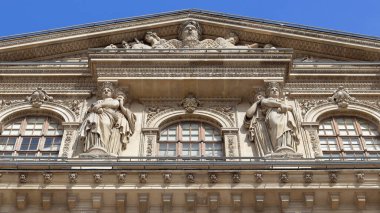 Architectural fragment of Louvre palace building in Paris, France