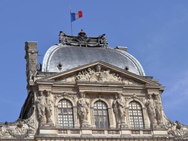 Architectural fragment of Louvre palace building in Paris, France