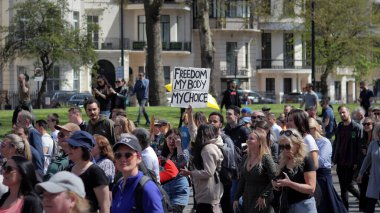London, UK - April 24, 2021: 'Unite for Freedom' protest by covid-19 sceptics, demonstrators opposing lockdown, vaccination, mask-wearing and health passports.