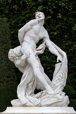 VERSAILLES / FRANCE - June 16, 2019: Antique statue in the park of Versailles palace near Paris, France