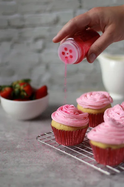 Muffins Decorated Pink Buttercream Frosting Top Red Baking Cups Grey — стоковое фото