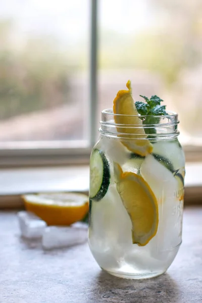 Glass Jar Water Lemon Cucumber Mint Marble Table Blurred Background — Fotografia de Stock