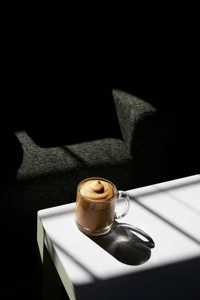 Iced Coffee Glass White Table Black Couch Background — Φωτογραφία Αρχείου