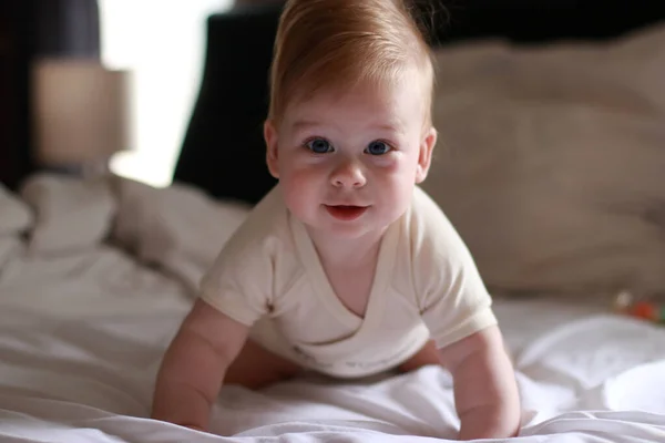 Portrait Happy Baby Bed White Sheets Blurred Background — Fotografia de Stock
