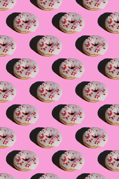 Pattern Glazed Donuts Covered Heart Sprinkles Pink Background — Stockfoto