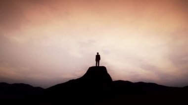 Man Standing on the Cliff of Mountain animation