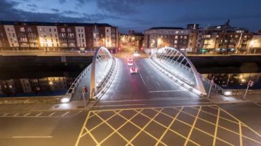 Timelapse of street traffic at dusk on James Joyce Bridge in Dublin