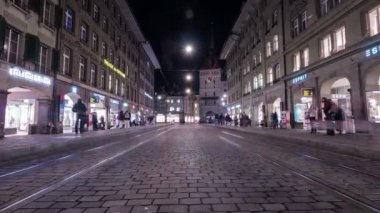Timelapse of trams at night in the city center