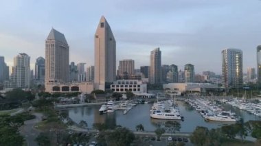 Aerial view of skyscrapers and anchored boats in San Diego, California.