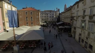 Aerial view of a city square with old buildings.