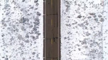 Aerial view of a snowy road