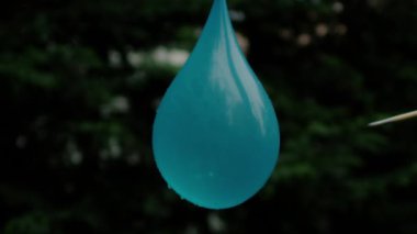 Arrow puncturing a water balloon, Ultra Slow Motion