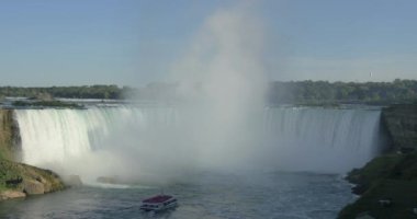 Boat navigating towards the waterfall at Niagara Falls, Canada