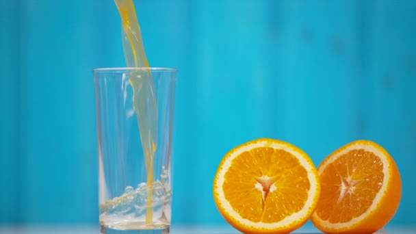 Orange Juice Being Poured Glass Oranges Royaltyfri Stockvideo