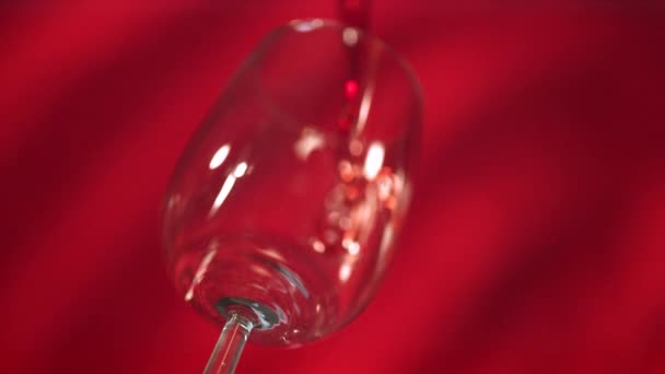 Red Wine Poured Glass Red Background — Stock videók