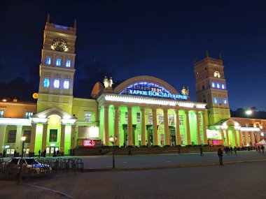 Railway station and square. Evening city. Illumination of beautiful architecture in Kharkiv, Ukraine - April 5, 2015
