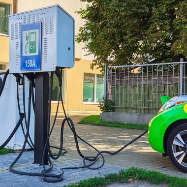 Electric car with charging station. Car charging place. Modern car. Eco friendly alternative energy