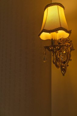 Wall lamp sconce with orange color. Free space for text