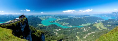 Outstanding panorama with Schafberg hilltop hut and the lakes of the Salzkammergut region in the Austrian alps at the state of Salzburg in Austria
