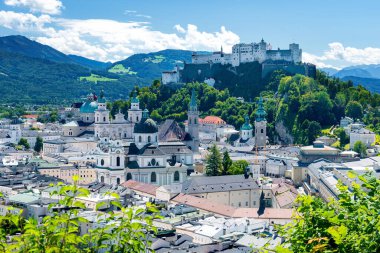 World heritage of the old town of Salzburg in Austria with medieval Hohensalzburg fortress and Salzkammergut mountains