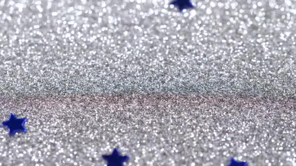 스타의 모양에서의 눈부신 반짝임 은색 배경에 클로즈업 — 비디오