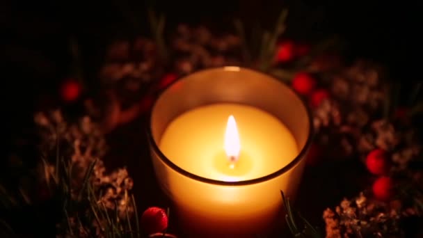 A lighted candle on a Christmas night — Stock Video