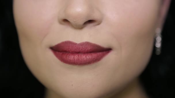 Girl smiles, closeup of lips — Wideo stockowe