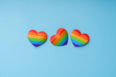 LGBTQ flag and symbol on table top view