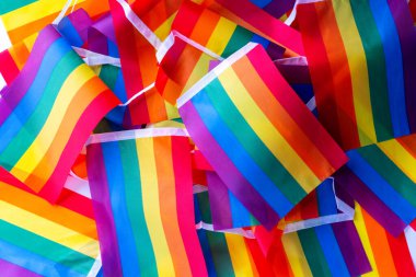 LGBTQ flag and symbol on table top view