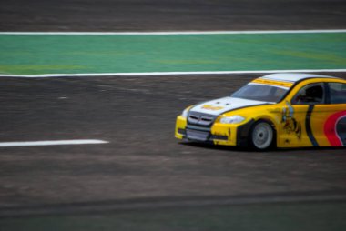 a group of sport cars on the road, remote control car