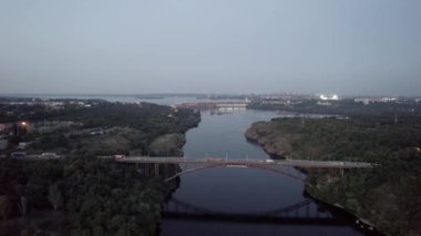 Night aerial view of the bridge and hydroelectric power station 4K