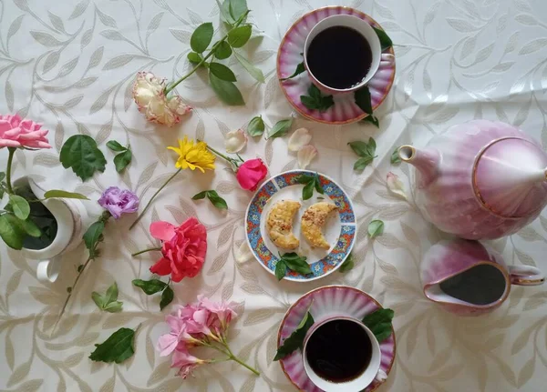 Two Cups Coffe Teapot Pastries Colourful Flowers — 스톡 사진